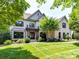Charming brick home features manicured lawn and inviting curb appeal at 18618 Rollingdale Ln, Davidson, NC 28036
