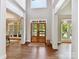Bright foyer showcasing hardwood floors, modern lighting, and open layout at 18618 Rollingdale Ln, Davidson, NC 28036