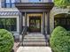 Grand entrance with double doors and brick columns creating a lasting first impression at 18618 Rollingdale Ln, Davidson, NC 28036