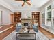 Comfortable living room with built-in shelving and a stone fireplace at 18618 Rollingdale Ln, Davidson, NC 28036