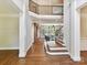 Stunning view of the living room from the foyer with elegant staircase at 18618 Rollingdale Ln, Davidson, NC 28036