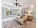 The main bedroom has a decorative ceiling, light paint color, and multiple windows for lots of light at 18618 Rollingdale Ln, Davidson, NC 28036