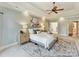 Spacious main bedroom features a decorative ceiling, light paint color, and double doors to the ensuite at 18618 Rollingdale Ln, Davidson, NC 28036