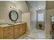Bathroom featuring a vanity with granite countertop and a round mirror above at 213 Cowboys Cir, Rock Hill, SC 29732