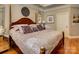 Cozy bedroom with hardwood floors, decorative pillows, and elegant lamps at 213 Cowboys Cir, Rock Hill, SC 29732
