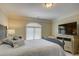 Comfortable bedroom featuring a large bed, a window with blinds, and a TV on an elegant dresser at 213 Cowboys Cir, Rock Hill, SC 29732