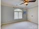 Bedroom with a large window, neutral wall color, and closet at 213 Cowboys Cir, Rock Hill, SC 29732