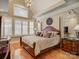 Primary bedroom with hardwood floors, ample natural light, and stylish furnishings at 213 Cowboys Cir, Rock Hill, SC 29732