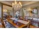 Elegant dining room featuring hardwood floors, chandelier, and large mirror at 213 Cowboys Cir, Rock Hill, SC 29732