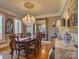 Elegant dining room featuring hardwood floors, chandelier, and large mirror at 213 Cowboys Cir, Rock Hill, SC 29732