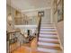 Open staircase showcasing iron railings and a view into the lower level living spaces at 213 Cowboys Cir, Rock Hill, SC 29732
