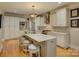 Spacious kitchen features an island with seating, stainless steel appliances and plenty of cabinet space at 213 Cowboys Cir, Rock Hill, SC 29732