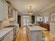 Bright kitchen with a large island, stainless steel appliances, and open floor plan at 213 Cowboys Cir, Rock Hill, SC 29732