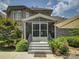 Close-up of screened in porch entrance with stairs and greenery at 213 Cowboys Cir, Rock Hill, SC 29732