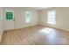 Bright bedroom with wood-look floors, a glass panel door and lots of light at 2414 Lane St, Kannapolis, NC 28083