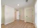 Bedroom featuring light-filled room with wood-look flooring and modern fixtures at 2414 Lane St, Kannapolis, NC 28083
