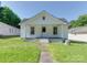 Charming white house featuring a covered porch and neat landscaping at 2414 Lane St, Kannapolis, NC 28083