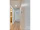 Bright hallway with wood-look flooring leading to a bathroom and other rooms at 2414 Lane St, Kannapolis, NC 28083