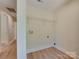 This well-lit laundry room has new connections and new flooring at 2414 Lane St, Kannapolis, NC 28083