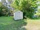 Outdoor storage shed in a grassy, tree-filled backyard at 2414 Lane St, Kannapolis, NC 28083