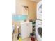 Cozy bathroom featuring a white sink vanity and stacked washer and dryer for added convenience at 3037 Marlowe Ave, Charlotte, NC 28208