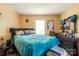 Bright bedroom featuring a blue comforter, natural lighting, and a spacious area at 3037 Marlowe Ave, Charlotte, NC 28208