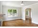 Sun-filled living room featuring hardwood floors, and white trim at 308 Davis Park Rd, Gastonia, NC 28052