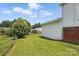 Backyard with lawn, chain link fence and view of the house at 310 Sidney Johnson St, Fort Mill, SC 29715