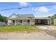 Charming home featuring a covered porch, a connected carport, and a well-maintained front lawn at 310 Sidney Johnson St, Fort Mill, SC 29715