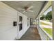Charming covered front porch with a ceiling fan and exterior door and a mailbox numbered 310 at 310 Sidney Johnson St, Fort Mill, SC 29715