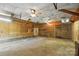 Spacious garage with ceiling fans and overhead lighting at 310 Sidney Johnson St, Fort Mill, SC 29715