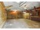 Large garage with a concrete floor, ceiling fans, and overhead lighting at 310 Sidney Johnson St, Fort Mill, SC 29715
