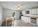 Bright eat-in kitchen featuring a ceiling fan, wood-look flooring, and an outside view at 310 Sidney Johnson St, Fort Mill, SC 29715