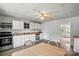 Functional kitchen with light wood countertops, white cabinets, and stainless steel appliances at 310 Sidney Johnson St, Fort Mill, SC 29715