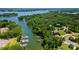 Aerial view showcasing a lake community surrounded by lush greenery with boat docks and stunning waterfront at 313 Sunset View Ct, York, SC 29745