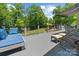 Relax on this spacious back deck, complete with comfortable lounge seating and scenic views of the yard at 313 Sunset View Ct, York, SC 29745