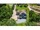 Expansive backyard with a large patio, deck, outdoor seating and a fire pit at 313 Sunset View Ct, York, SC 29745