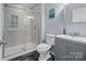 This bathroom features a glass enclosed shower, a modern vanity, and stylish tile flooring at 313 Sunset View Ct, York, SC 29745