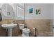 Bathroom featuring a modern sink with pedestal and neutral tile at 313 Sunset View Ct, York, SC 29745