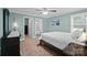 Bright bedroom with a comfortable bed, a serene color palette, and ample natural light at 313 Sunset View Ct, York, SC 29745