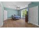 Bedroom with hardwood floors, fan, and large window at 313 Sunset View Ct, York, SC 29745