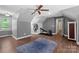 Spacious room featuring a ceiling fan, workout equipment, and hardwood flooring at 313 Sunset View Ct, York, SC 29745