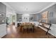 Inviting dining room with hardwood floors, chandelier lighting, and neutral paint colors at 313 Sunset View Ct, York, SC 29745