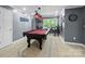 Recreational game room with pool table, wet bar, and bright natural light at 313 Sunset View Ct, York, SC 29745