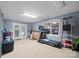 Bright gym with a treadmill, ample space for activities, and a door to the exterior at 313 Sunset View Ct, York, SC 29745