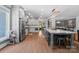 Modern kitchen with gray cabinetry, large island, and stainless steel appliances at 313 Sunset View Ct, York, SC 29745