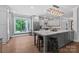 Bright kitchen with a large island, stainless steel appliances, and ample counter space at 313 Sunset View Ct, York, SC 29745