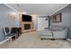 Living room with a stone fireplace, comfortable couch, and neutral-colored carpet at 313 Sunset View Ct, York, SC 29745