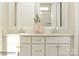 Bright bathroom featuring a double vanity with white cabinets and quartz countertop, complemented by modern fixtures at 3823 Horsham St, Indian Land, SC 29707