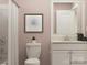 Cozy bathroom showcases a toilet and vanity, complemented by a shower with a curtain at 3823 Horsham St, Indian Land, SC 29707